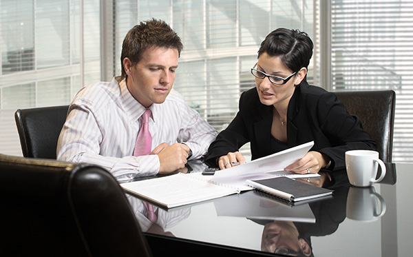 Young and good-looking business people are working in the meeting room.